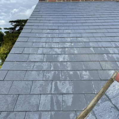 Slate roof with neatly aligned courses and adjoining roof valley
